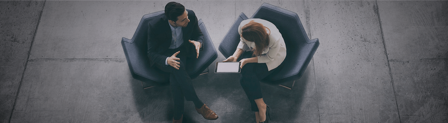 man and woman formally dressed having a conversation banner