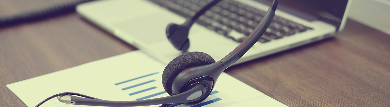 laptop and headset on desk banner