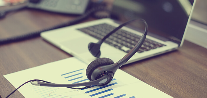 laptop and headset on desk mobile banner